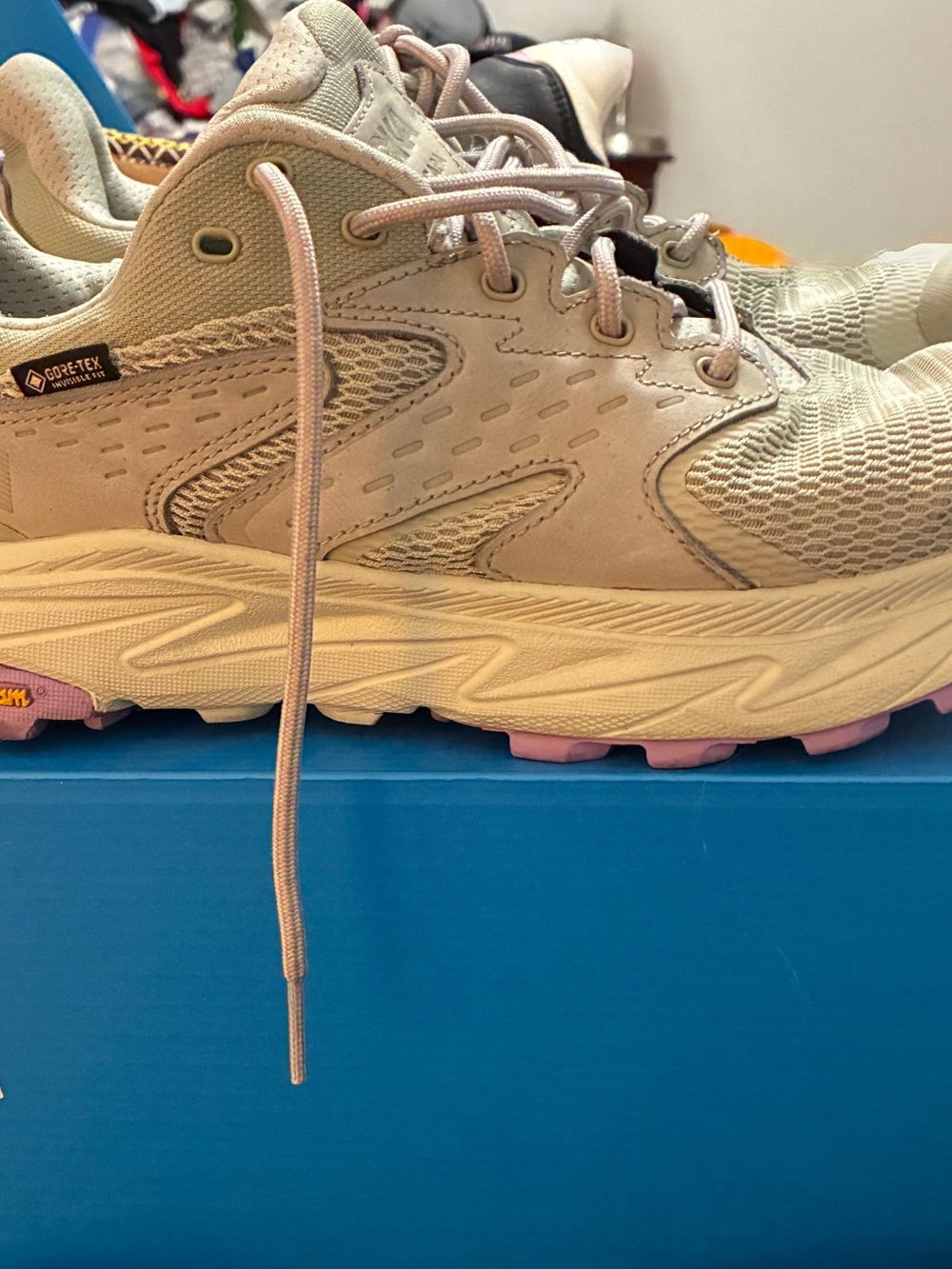 Hoka Women's Beige Trail Shoe with lilac Purple Outsole Accents